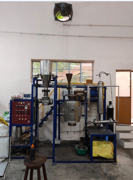 Experimental rig with feed hopper and control panel at CSIR-IICT